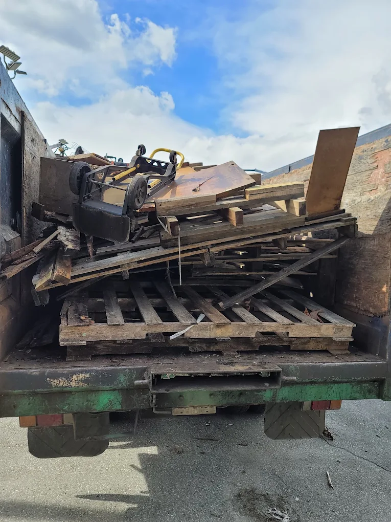 Junk removal truck loaded after a residential pickup